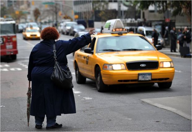 USA NYC Taxi lady hailing source - thedailybeast